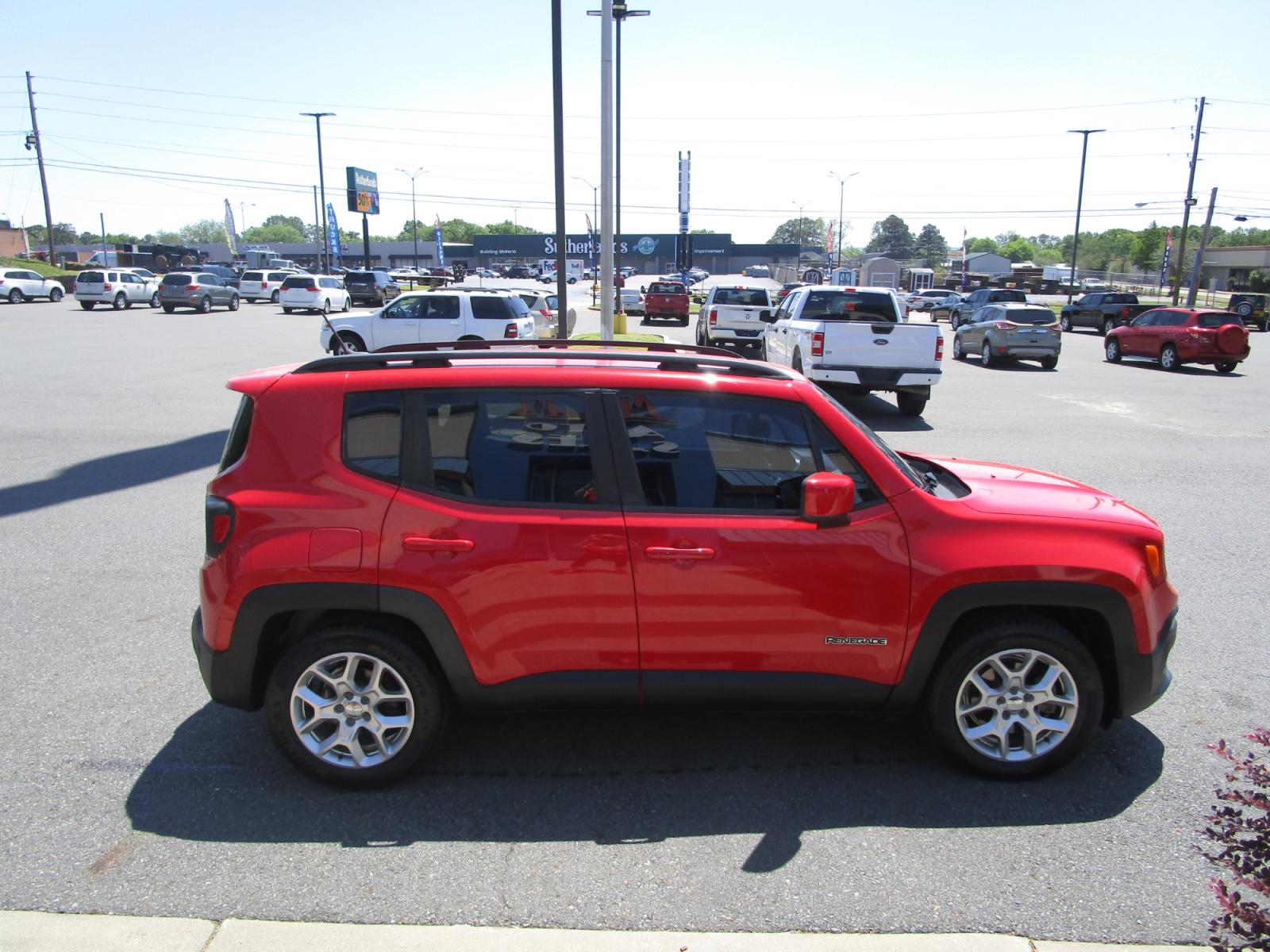 2015 RED /Black / Cloth Jeep Renegade Latitude FWD (ZACCJABT0FP) with an 2.4L L4 engine, 6-Speed Manual transmission, located at 1814 Albert Pike Road, Hot Springs, AR, 71913, (501) 623-1717, 34.494228, -93.094070 - Photo #2
